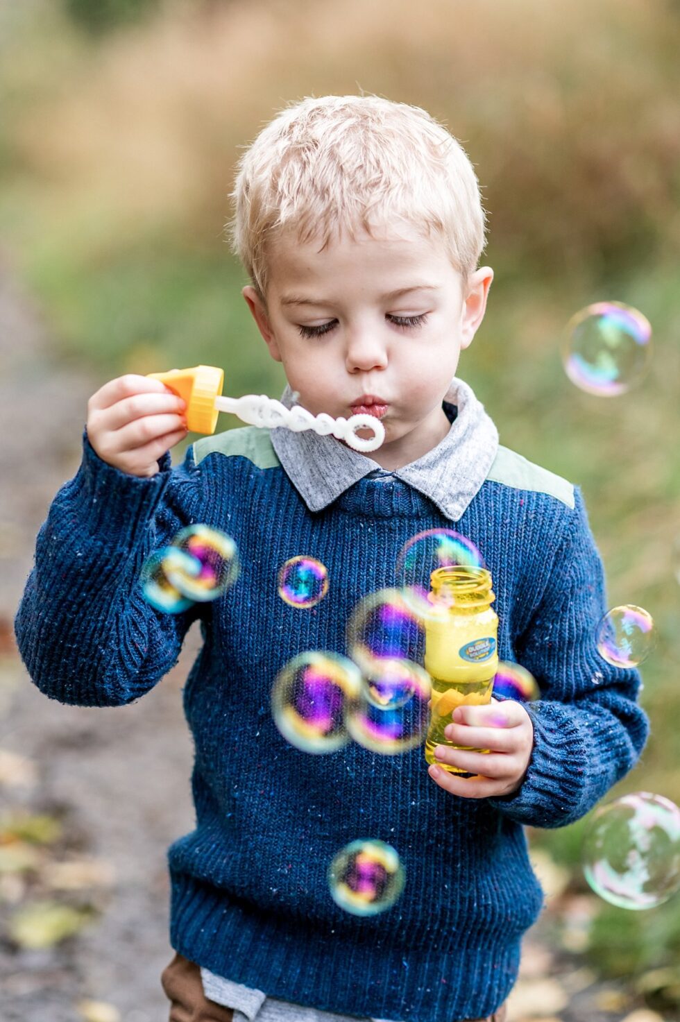 Boy blowing bubbles in children's photography session in Skipton, North Yorkshire