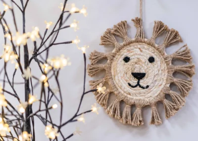 Crafted lion wall decoration photographed in a nursery setting for pre-school marketing brochures in Leeds, West Yorkshire