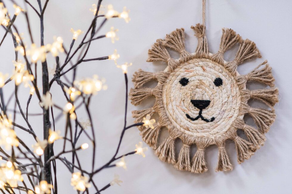 Crafted lion wall decoration photographed in a nursery setting for pre-school marketing brochures in Leeds, West Yorkshire