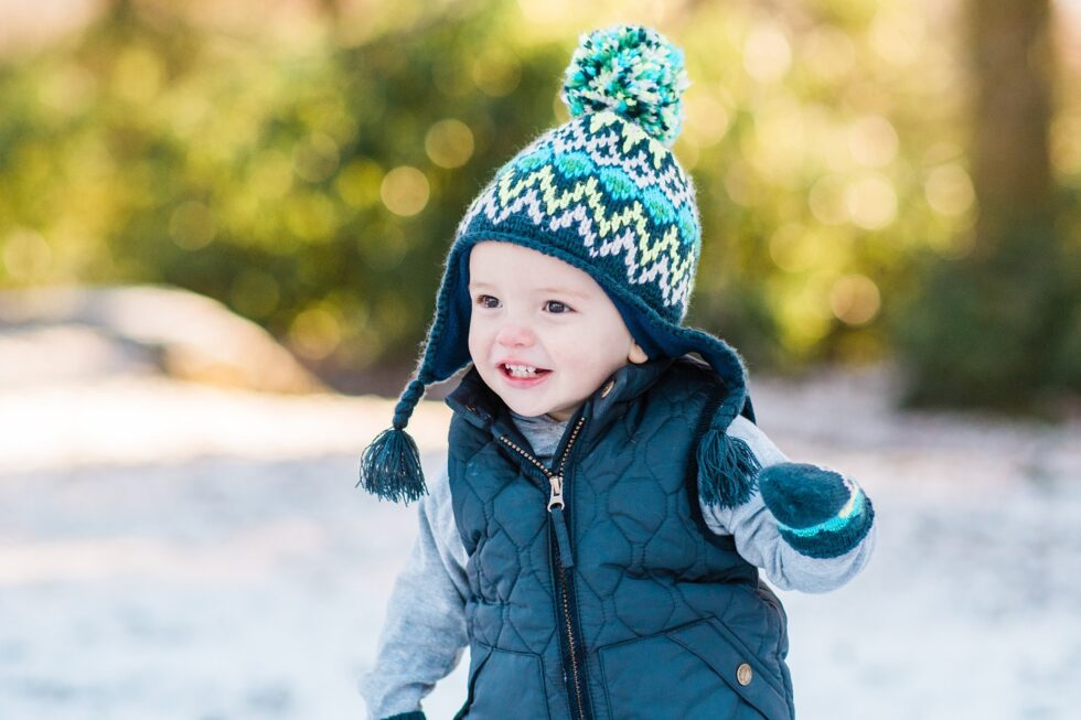Little boy wearing a knitted hat during a winter family photo shoot in Ilkley, Yorkshire